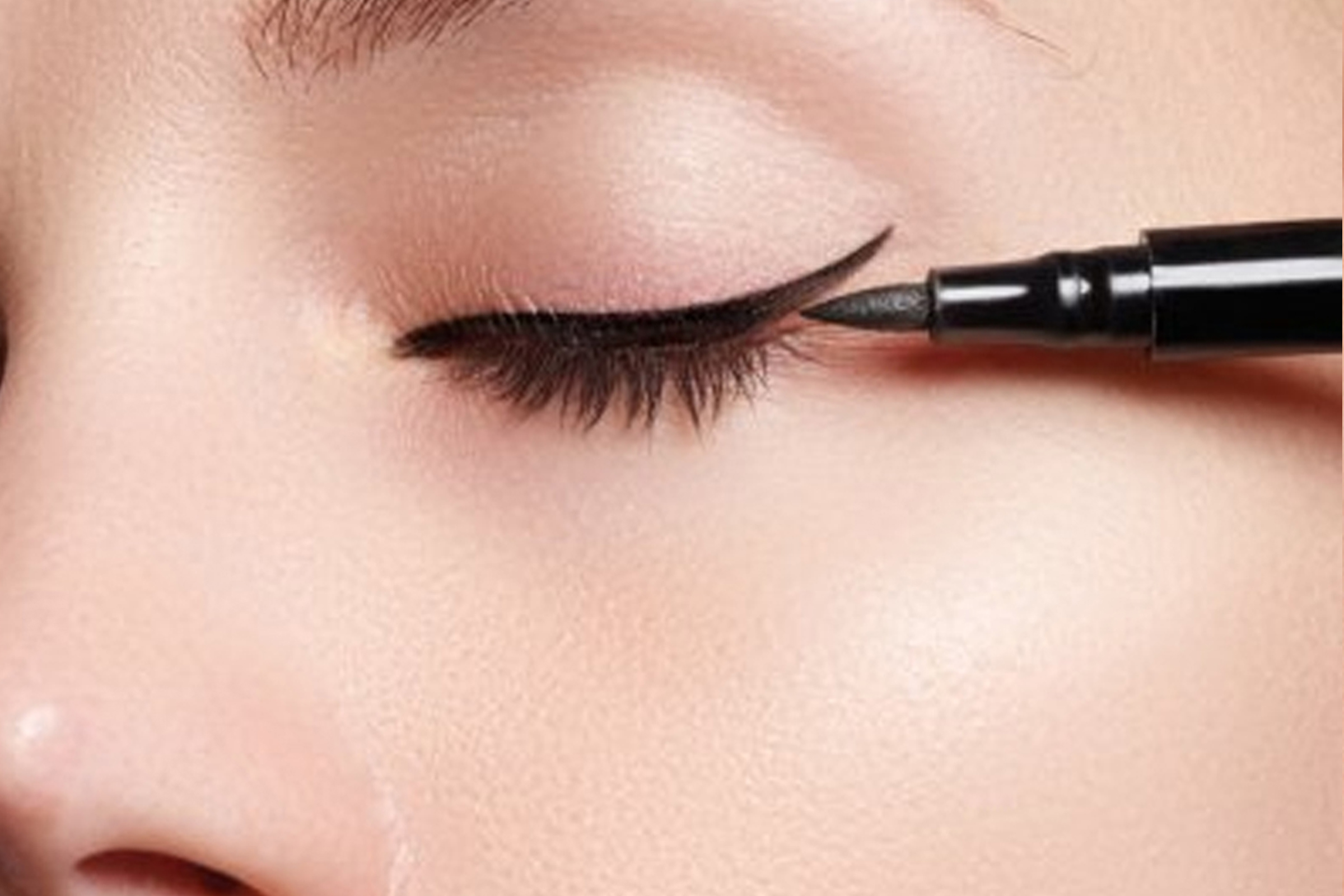 A close up of a person with eyeliner on